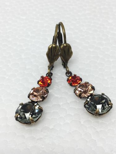 23mmVintage Swarovski and Preciosa Crystals, Hyacinth, Light Peach, and Black Diamond, Brass Earrings on Antique Brass shell lever- back wires. 